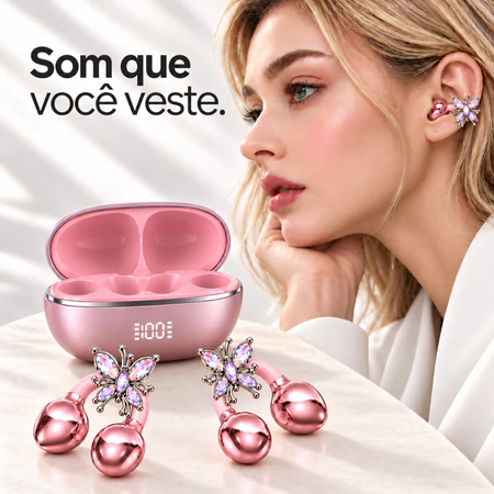 Fone clip rosa com borboleta de cristais usado na orelha